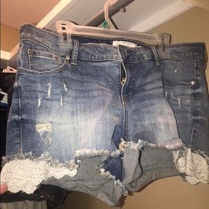 Torrid Distressed shorts with lace